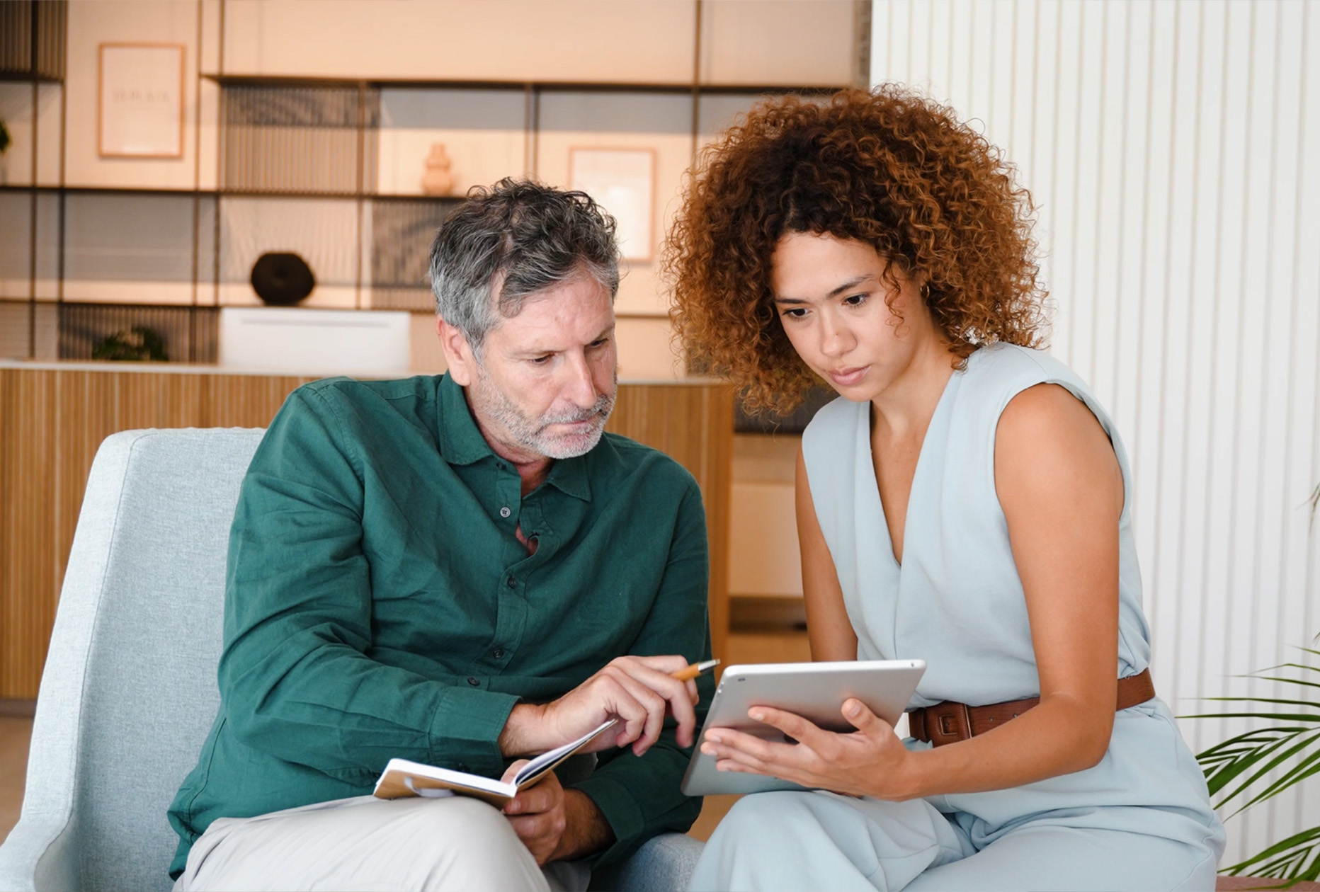 Woman and Man Working on iPad