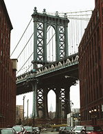 Manhattan Bridge viewed between historic buildings in New York City