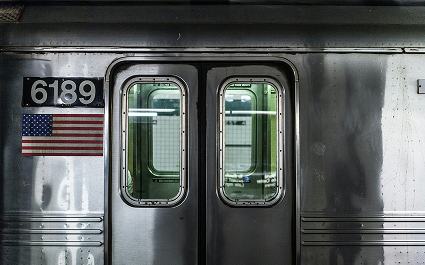 New York City subway train at a station platform