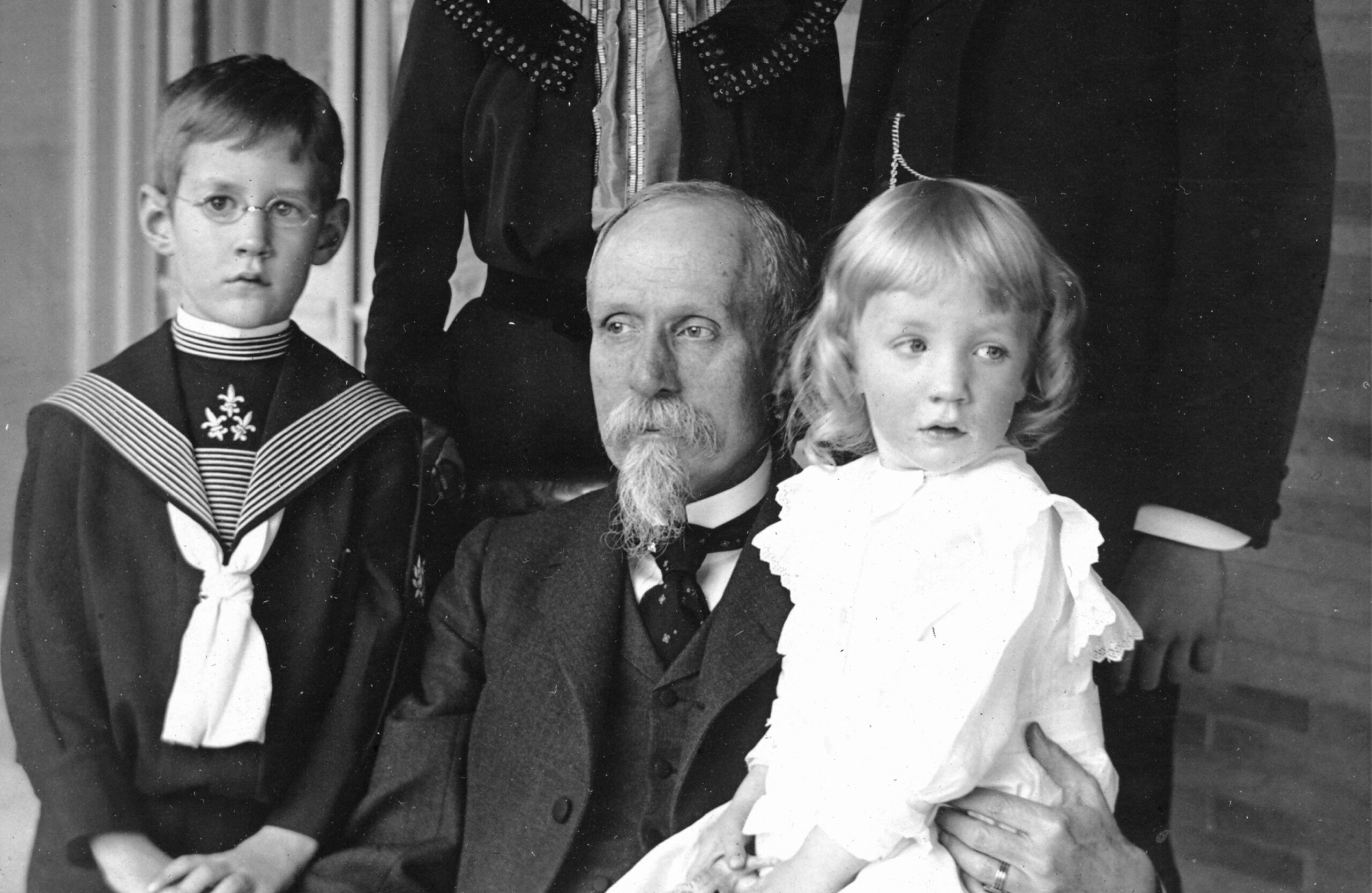 Old photo of family including parents and children