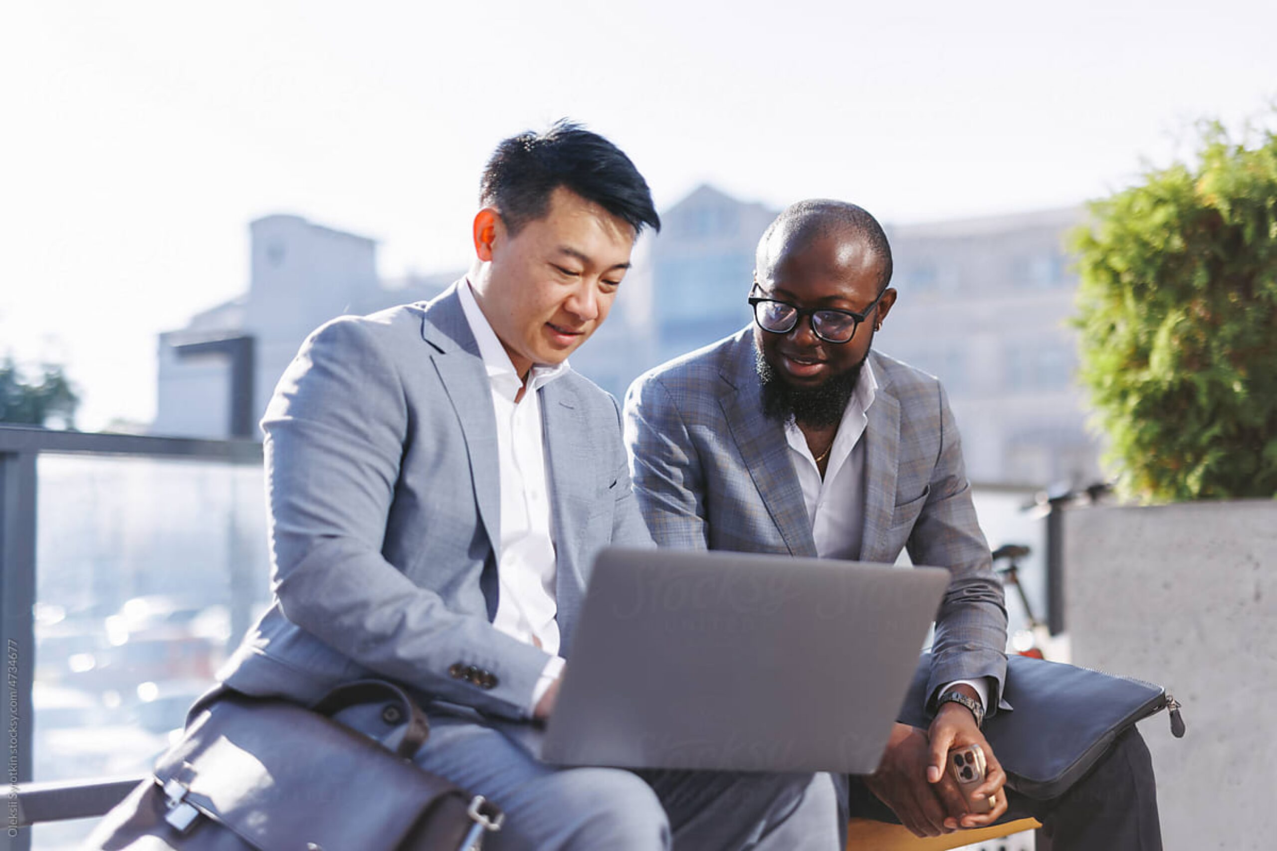 Two financial professionals working casually together