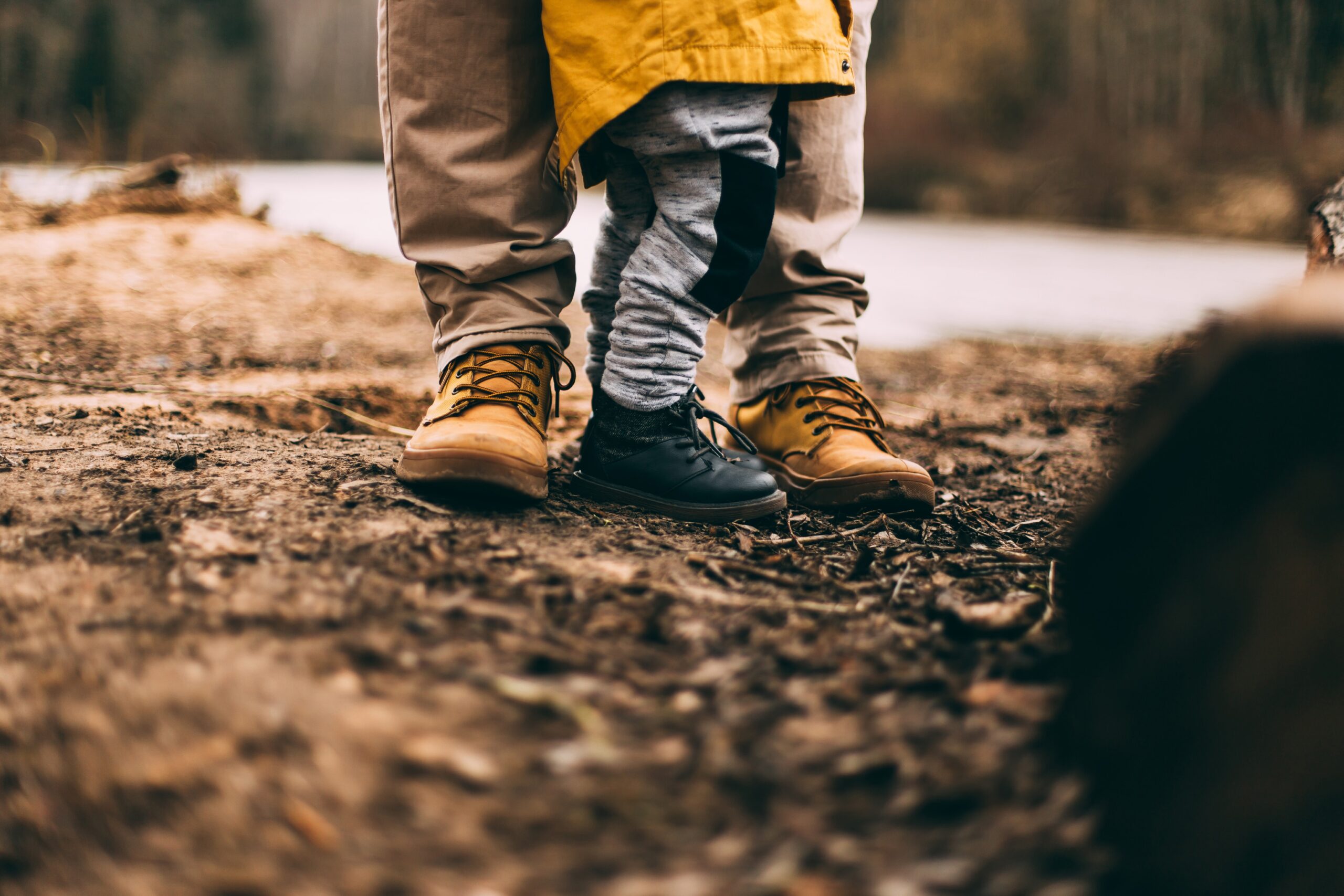 Generational photo of parent and child together outdoors